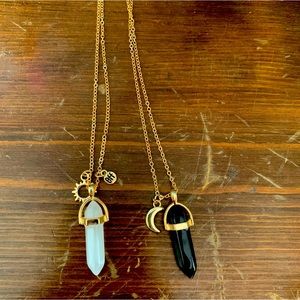 Claire’s friendship necklaces. One black one white.